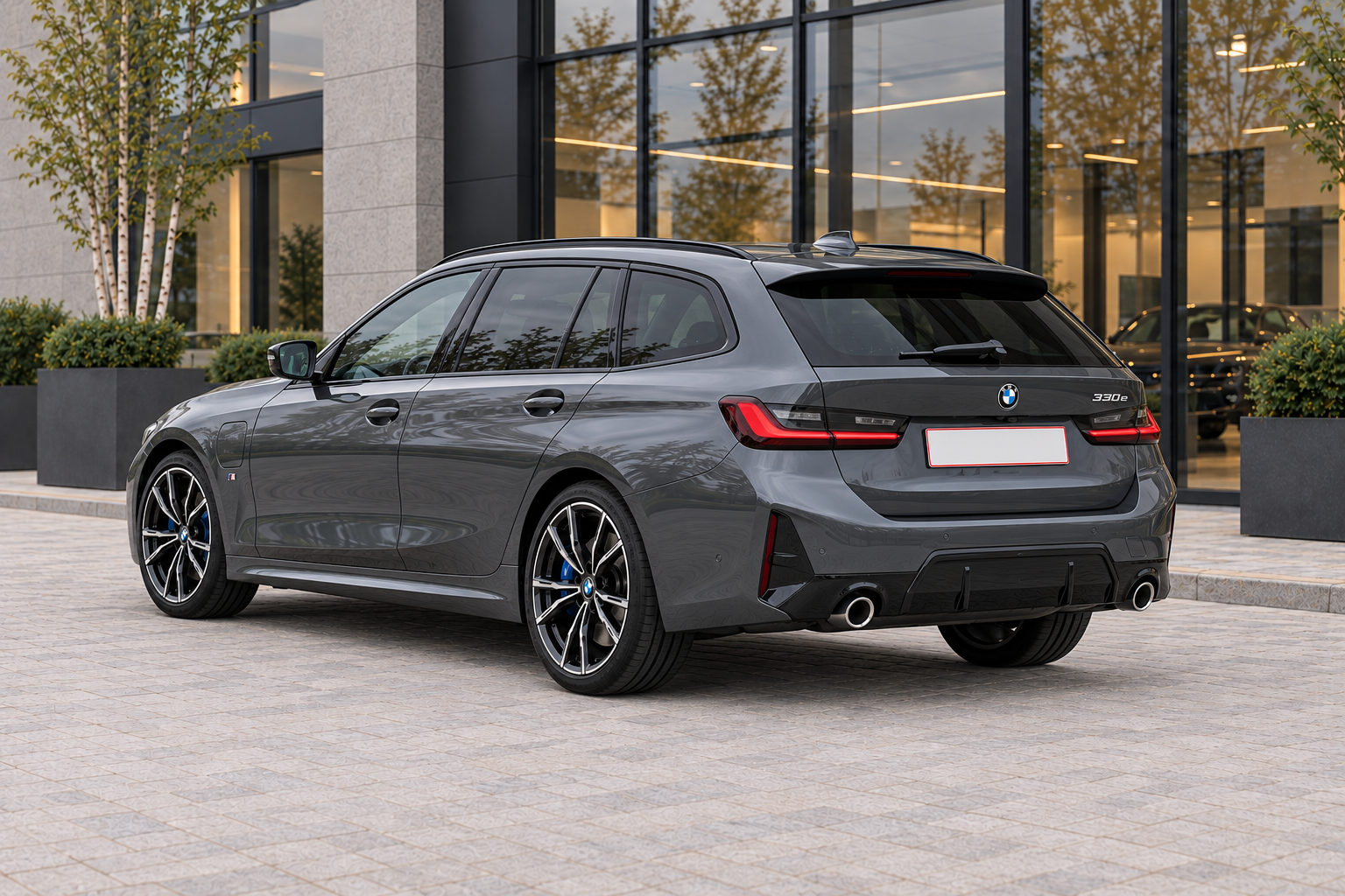 BMW 330e Touring — rear three-quarter view