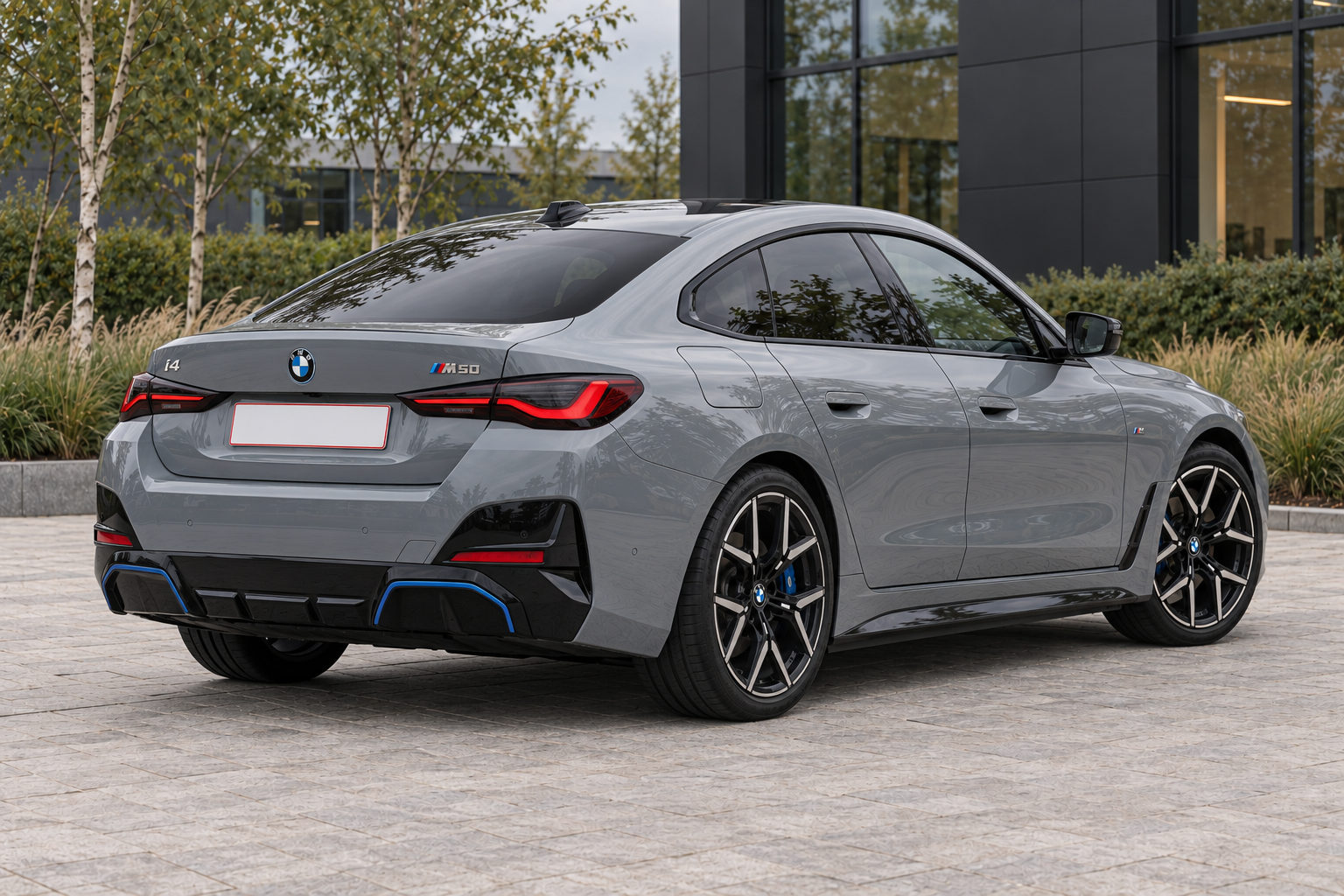 BMW i4 M50 — rear three-quarter view