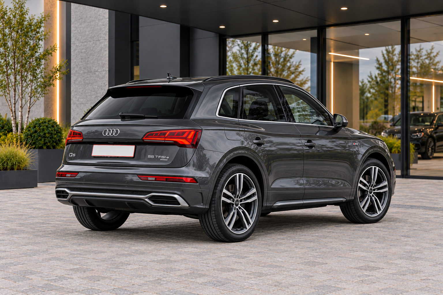 Audi Q5 55 TFSI e — rear three-quarter view